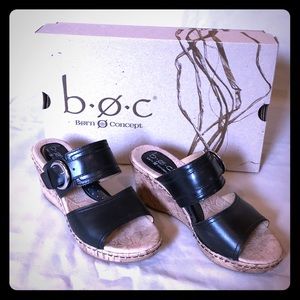 Black leather cork wedge slip on sandals.